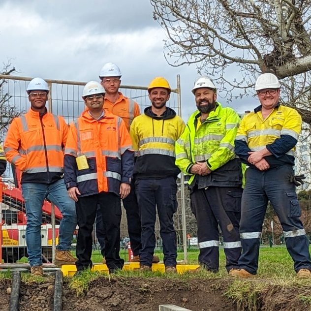 Project team standing together on-site after successfully completing the Aughtie Drive Project for Multinet Gas Networks.