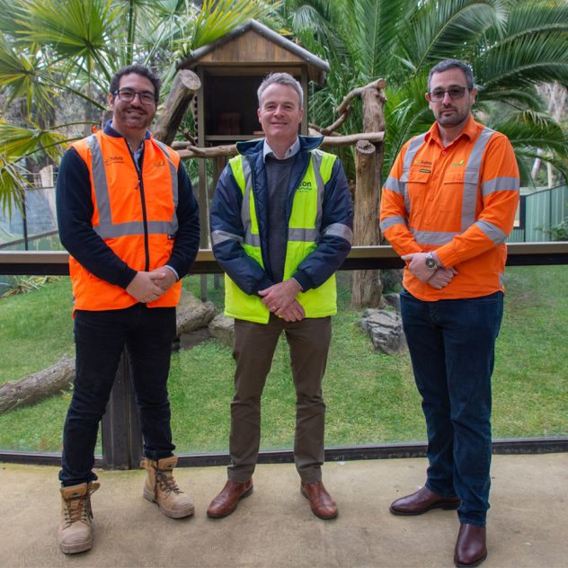 Team at the animal enclosures at the National Zoo enriched with repurposed trees from Diona's Belconnen Trunk Sewer project.