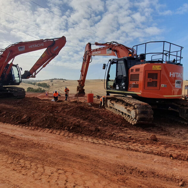 Workers and machinery in action at the Gawler East Link Road construction site.