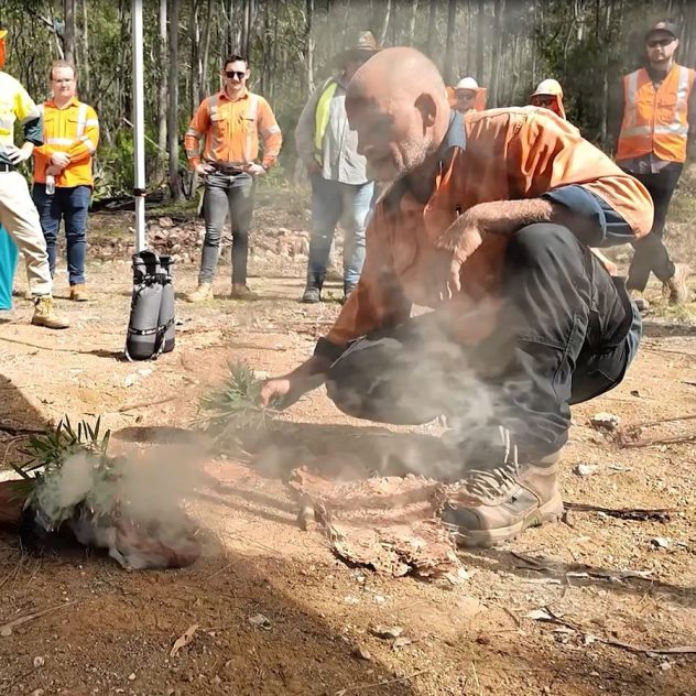 Traditional Owner James Bonner lighting a fire for the smoking ceremony at the Esk Reservoir project launch.